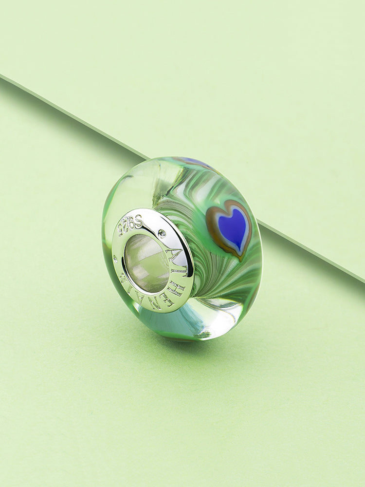 Feather Murano glass charm bead styled on European charm bracelet