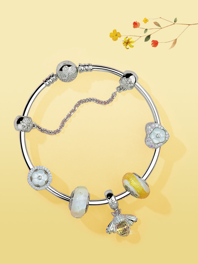 Floral pearl charm bead paired with sterling silver bracelet