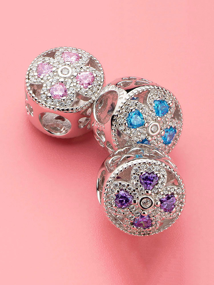 Violet flower charm bead styled on sterling silver bracelet