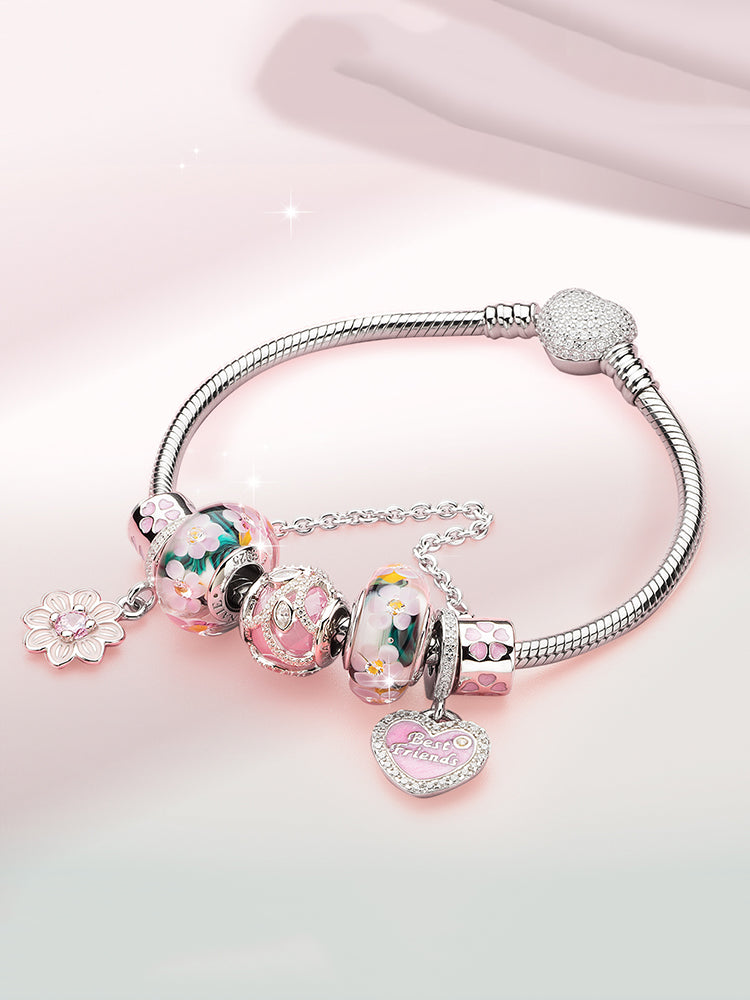 Flower safety chain charm styled on silver charm bracelet