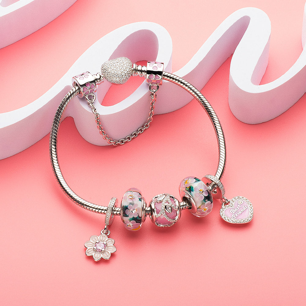Complete charm bracelet styled with Forever Friends pendant and meaningful charms for family, love, and protection