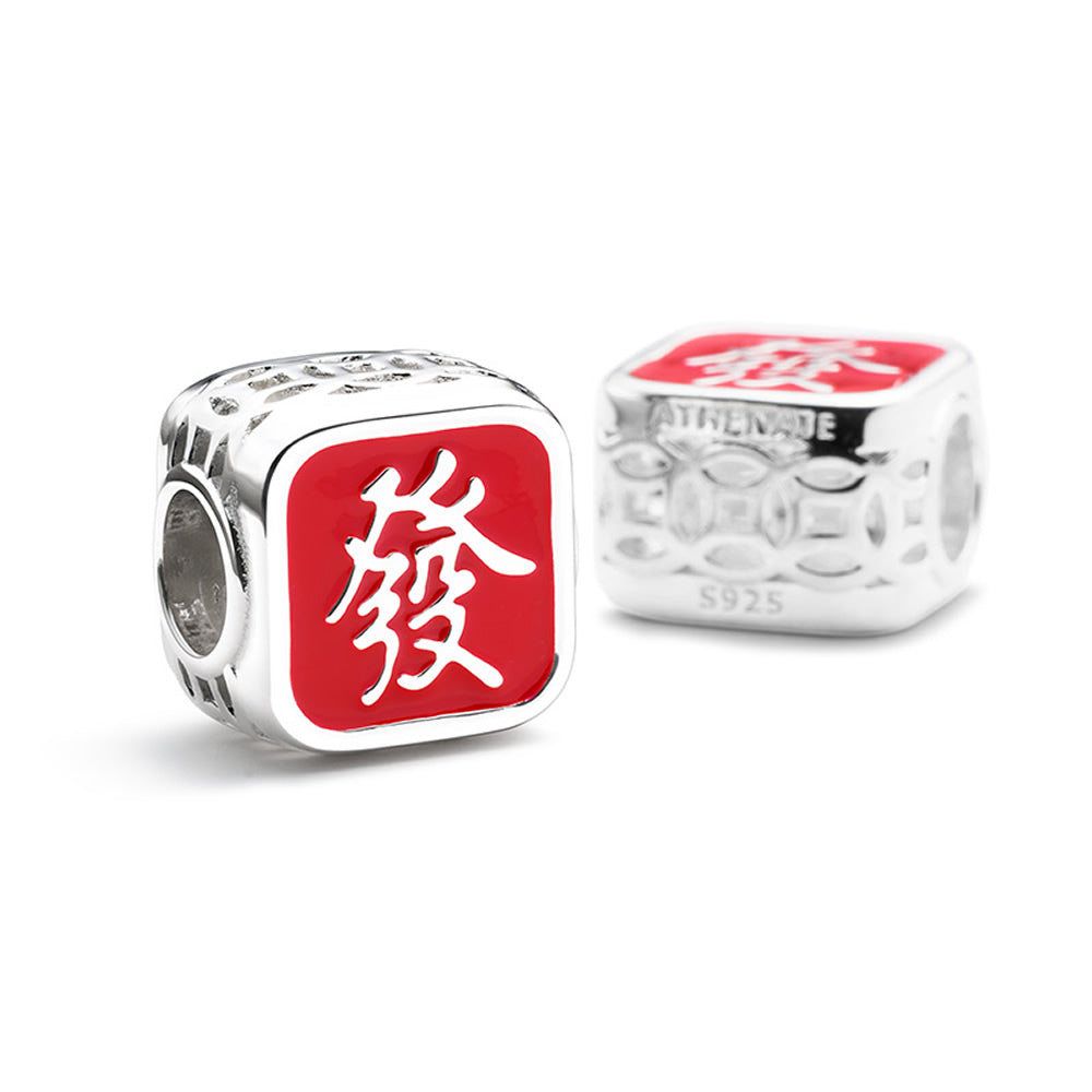 Fortune Charm enamel bead displayed in festive bracelet scene.