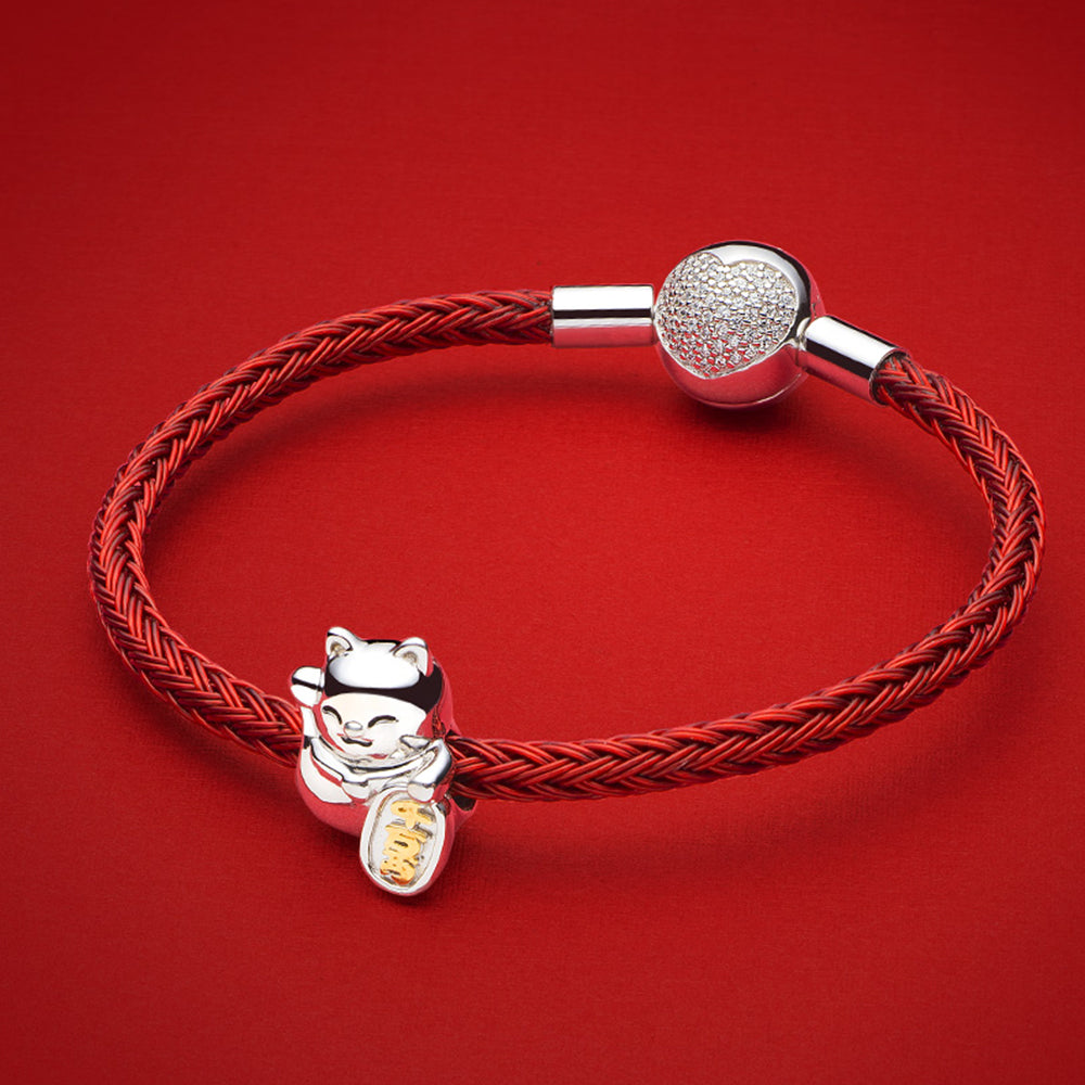 Fortune Kitty charm bead styled on silver bracelet with CZ and gold accents for a festive look