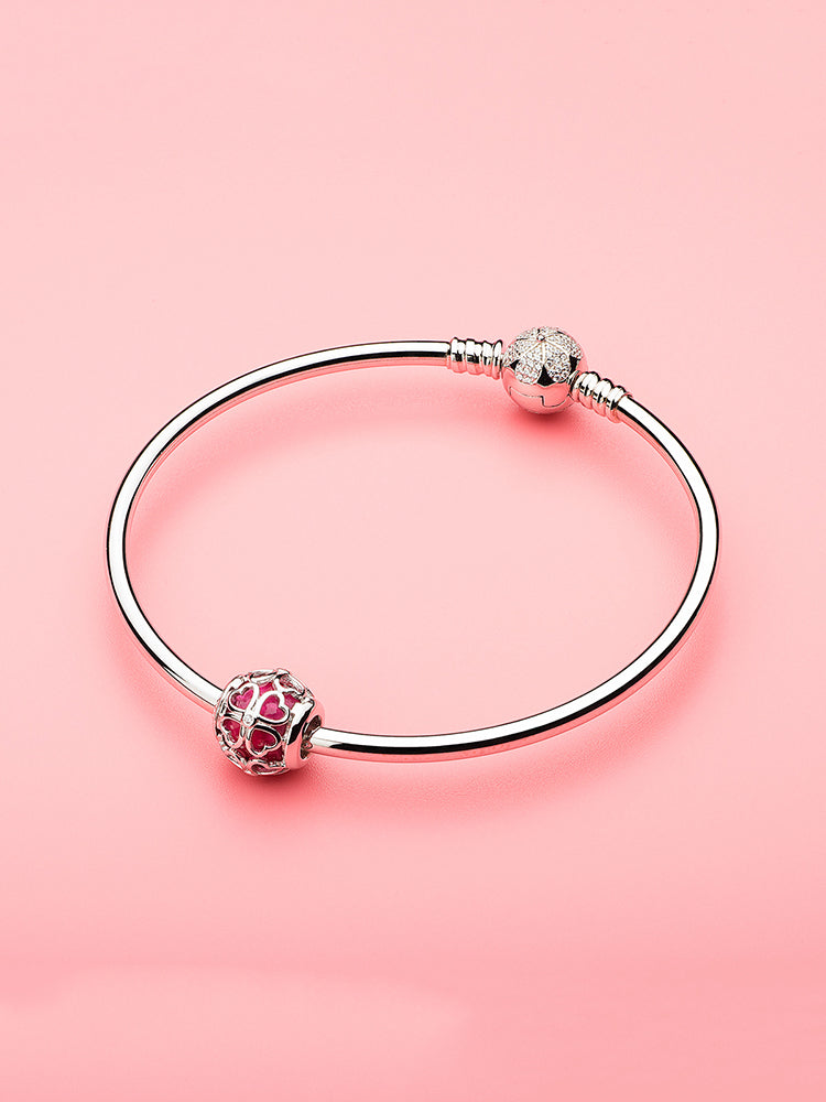 Crimson Four Leaf Clover charm bead styled on silver charm bracelet