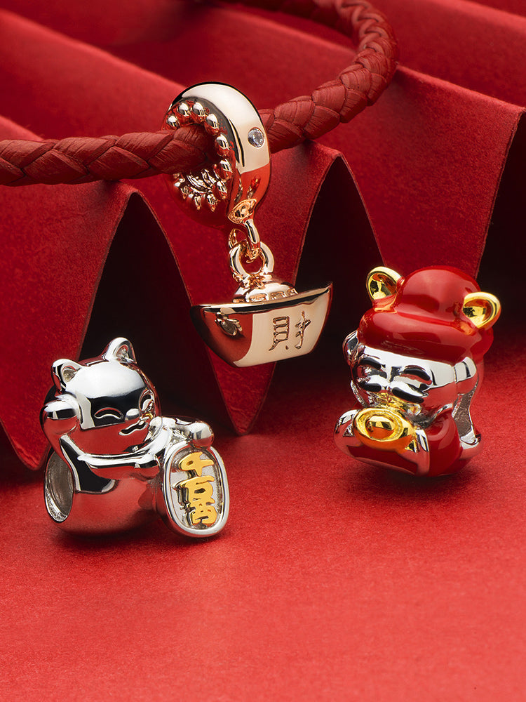 God of wealth charm bead detail symbolic prosperity design