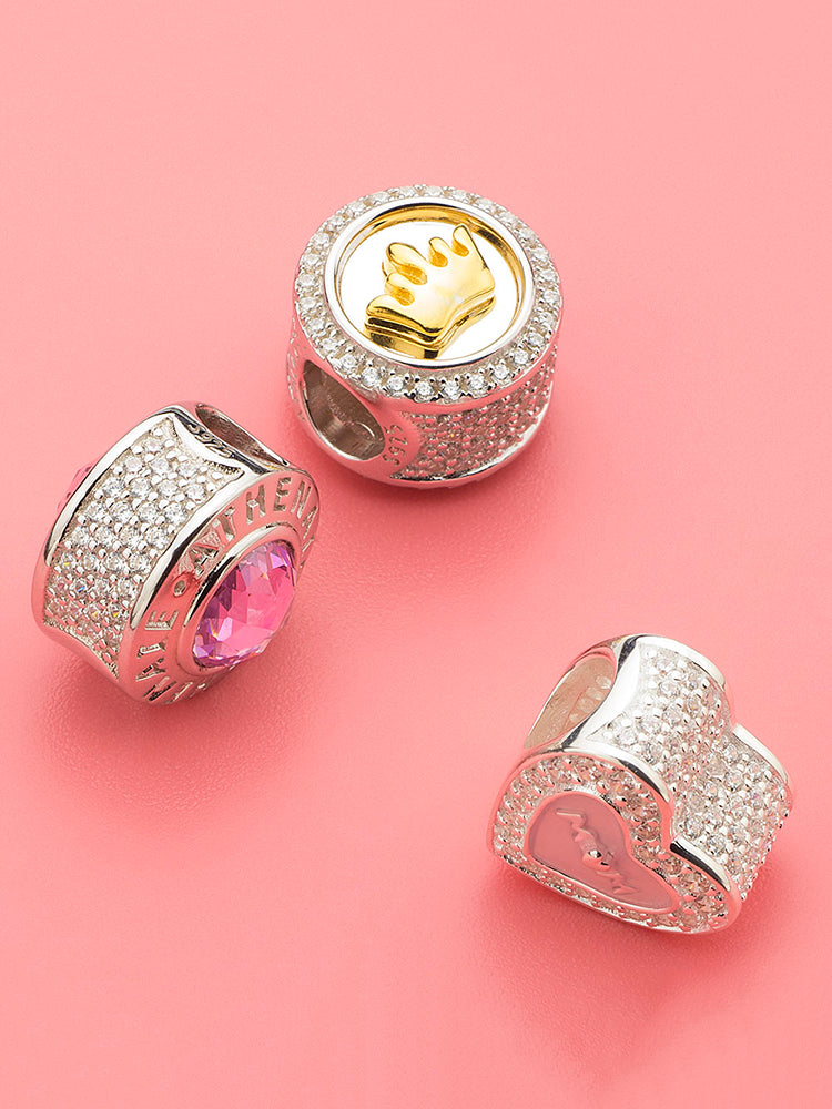 Gold-tone crown charm with other charms
