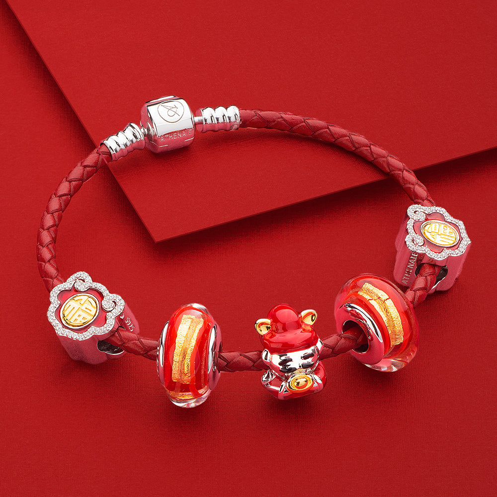 Golden Flame Murano glass charm styled with 925 silver bracelet