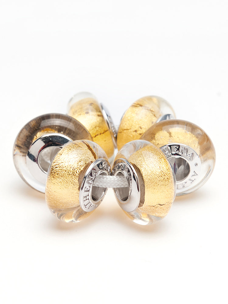 Golden halo murano glass charm detail on European style bracelet