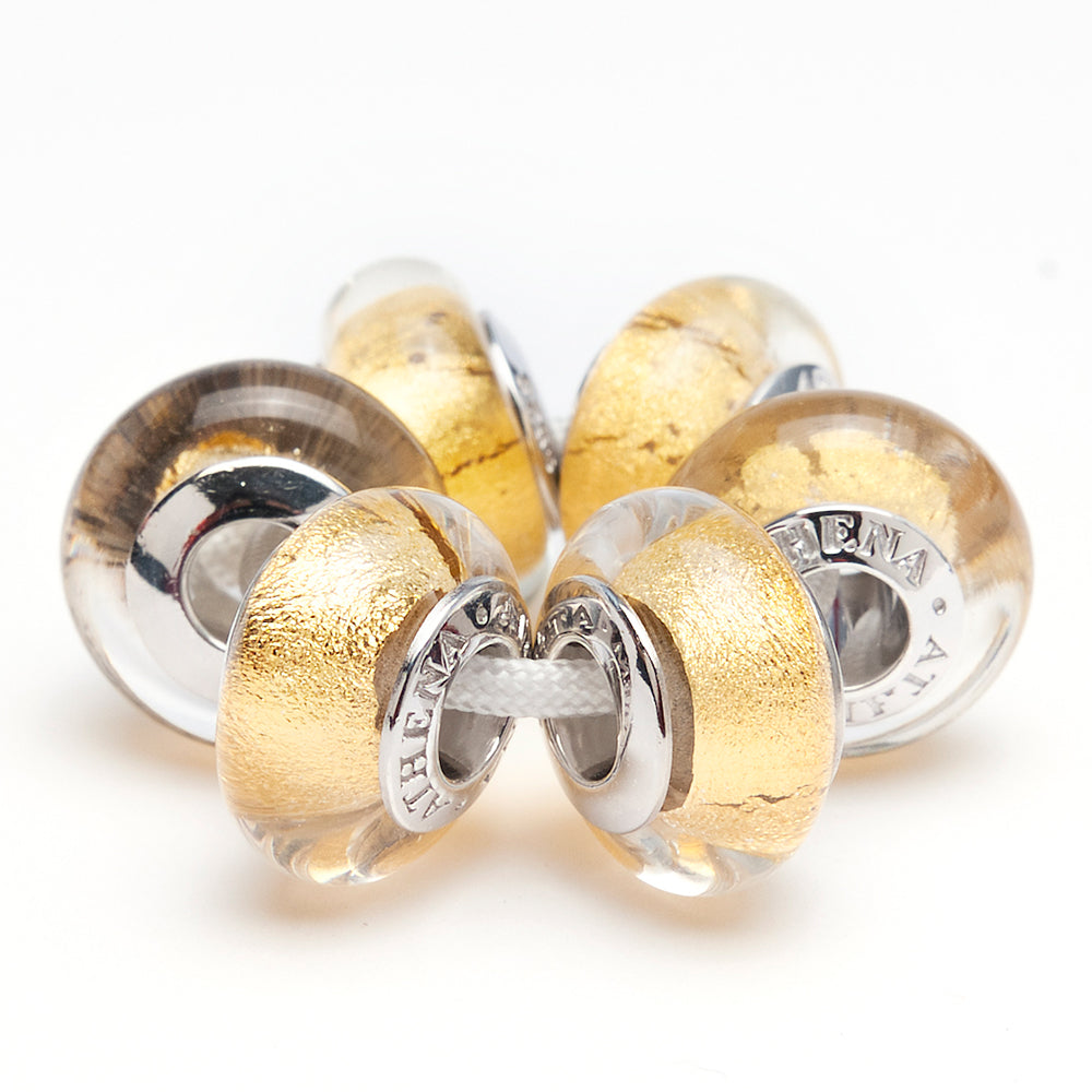 Elegant Murano glass charm with gold foil in natural light scene