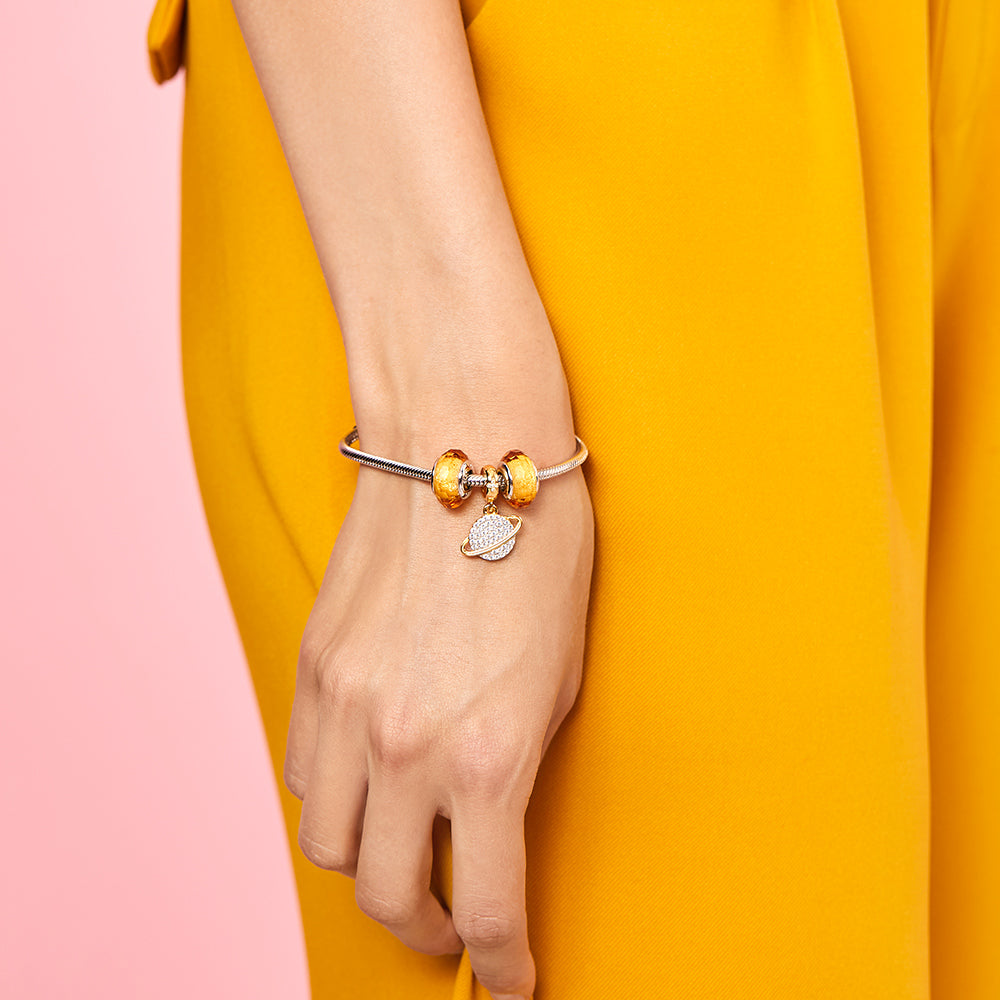 Close-up of Golden Spark Murano Glass Charm on Bracelet – Elegant Jewelry by ATHENAIE