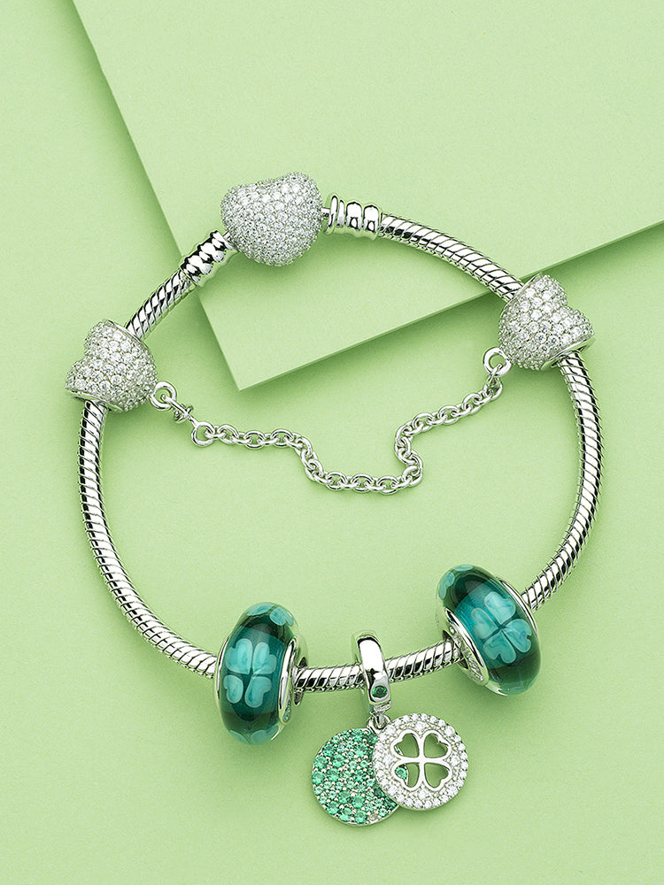 Green four-leaf clover Murano glass bead on a silver charm bracelet