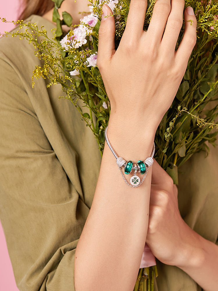 Green four-leaf clover Murano glass bead on the wrist, close view