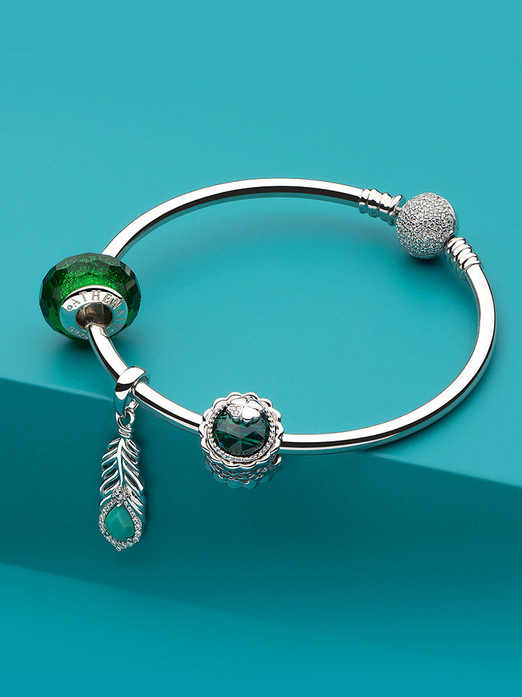 Green Murano glass charm bead styled on European charm bracelet