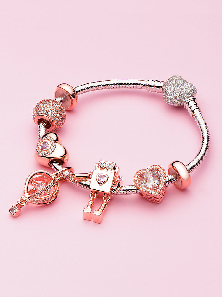 Rose gold heart charm bead styled on charm bracelet