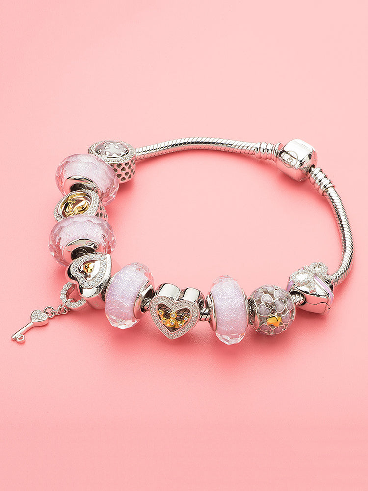 Charm bracelet look featuring sterling silver heart clip charm