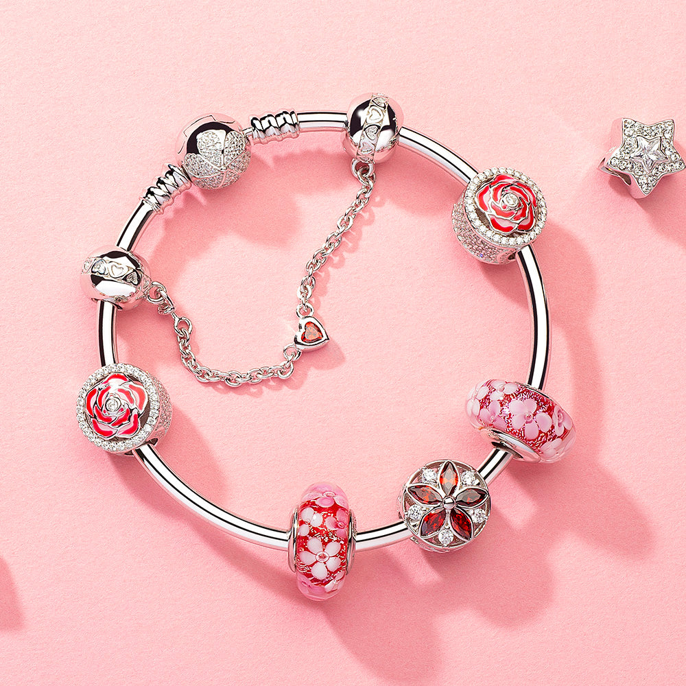 Model wearing Heart Guard safety chain with charm bracelet, showcasing secure and elegant bracelet style