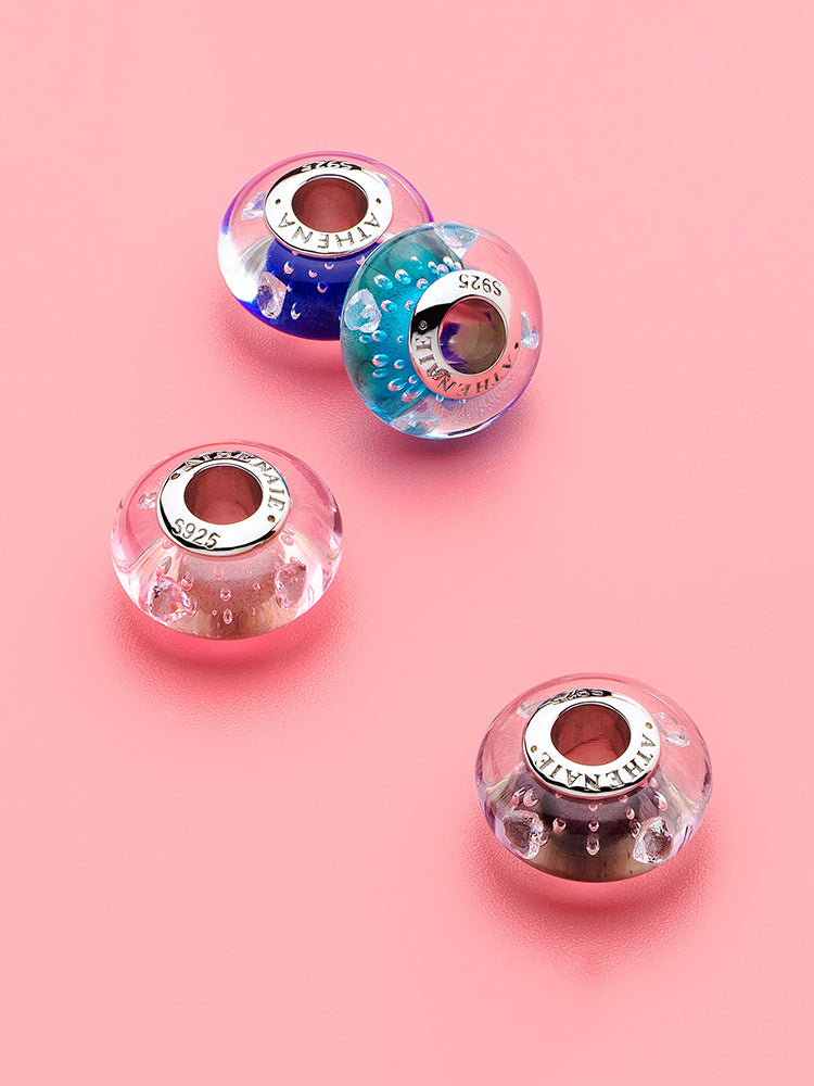 Midnight heart murano glass charm styled on silver charm bracelet