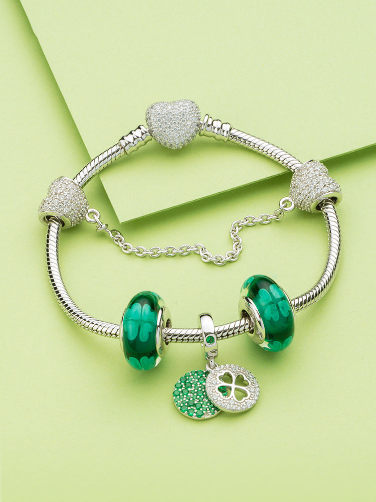 Pavé heart safety chain charm styled with bracelet charms