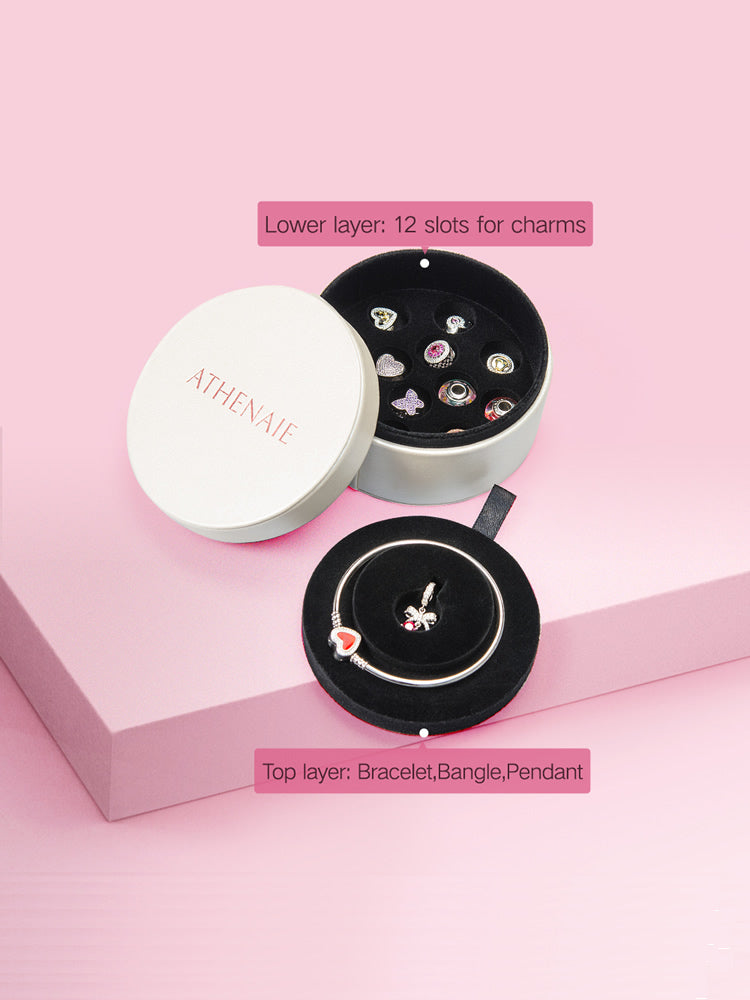 Jewelry organizer box displaying charms and bracelets collection