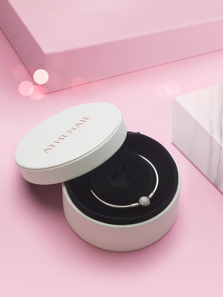 Jewelry organizer box storing charm beads and bracelets neatly