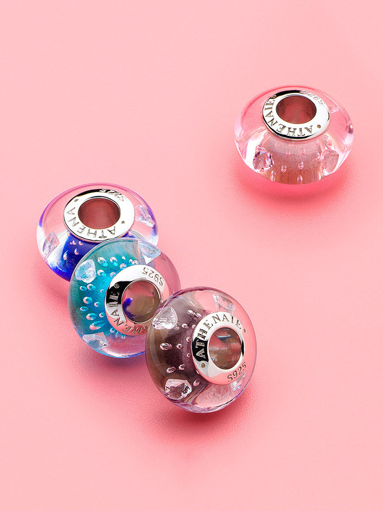 Lavender heart murano glass charm styled on silver charm bracelet