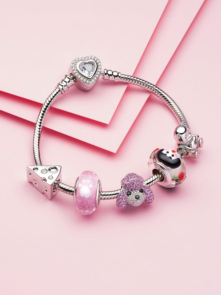 Little girl and cherry Murano glass bead on a silver charm bracelet