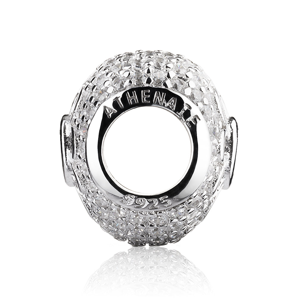 Sterling silver Love in Bloom charm shown in a lifestyle setting with sparkling zirconia and floral detail