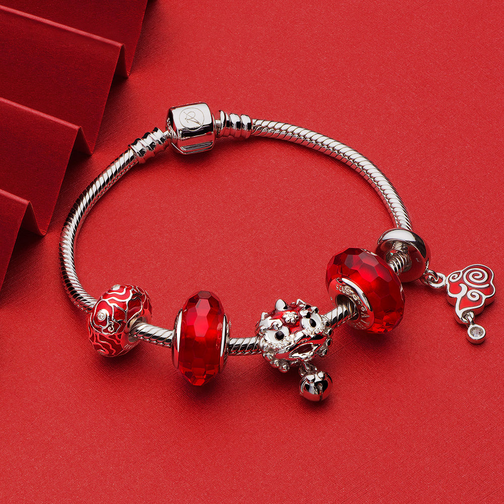 Lucky Cloud pendant charm styled on silver bracelet with festive charms