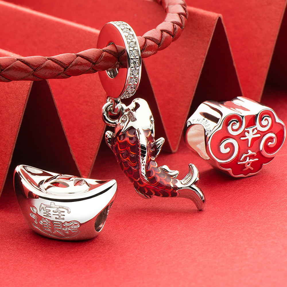 Lucky Koi enamel charm pendant styled in festive bracelet scene.