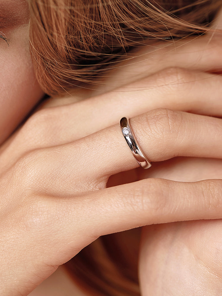 Luna bezel CZ minimalist ring on finger close view