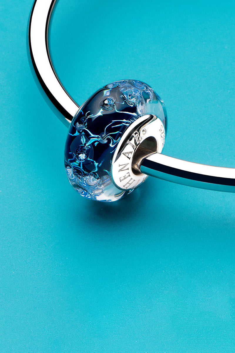 Midnight galaxy murano glass charm bead styled on bracelet by ATHENAIE