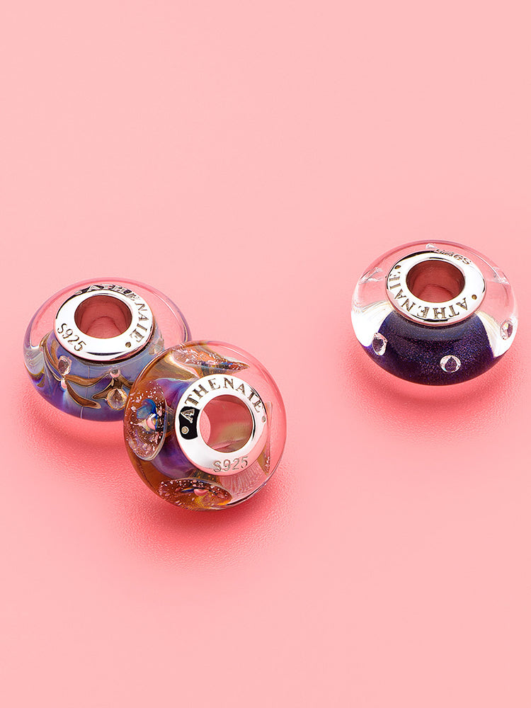 Midnight galaxy murano glass charm styled on sterling silver charm bracelet