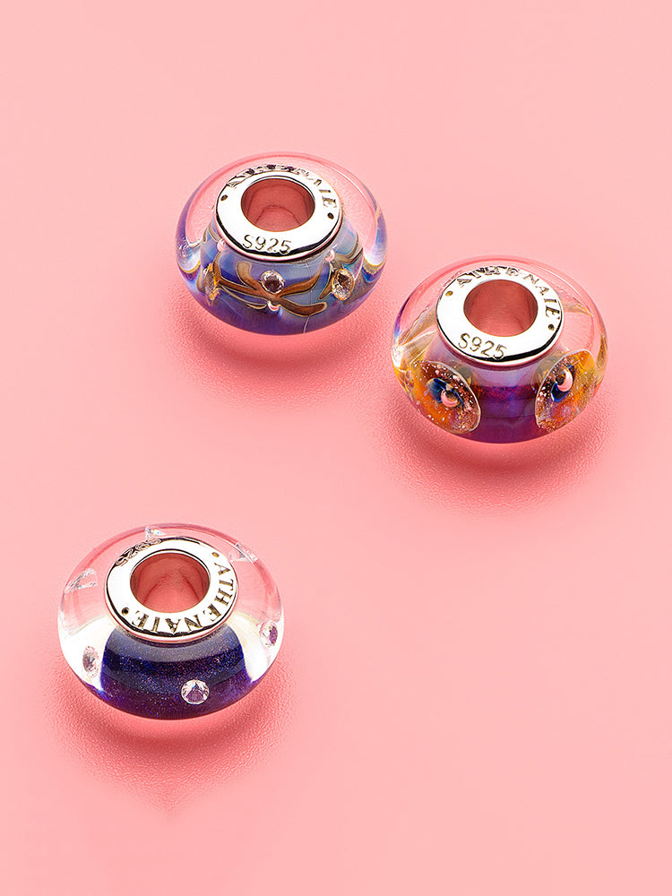 Midnight galaxy murano glass charm detail on sterling silver bracelet