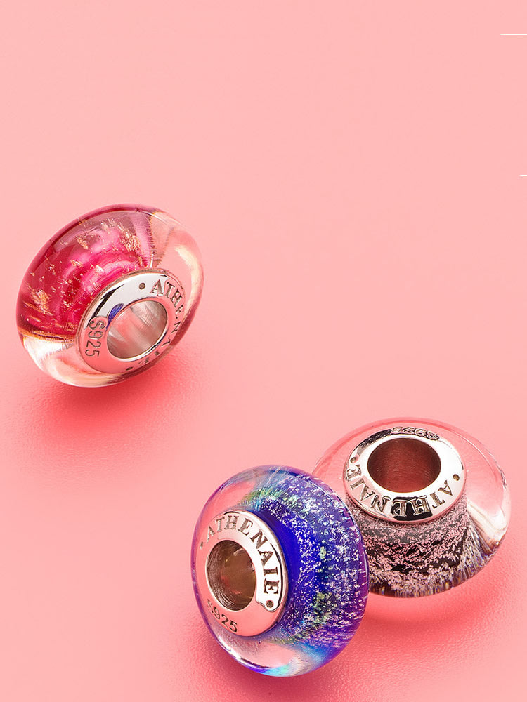 Close view of midnight lagoon murano glass charm on European bracelet