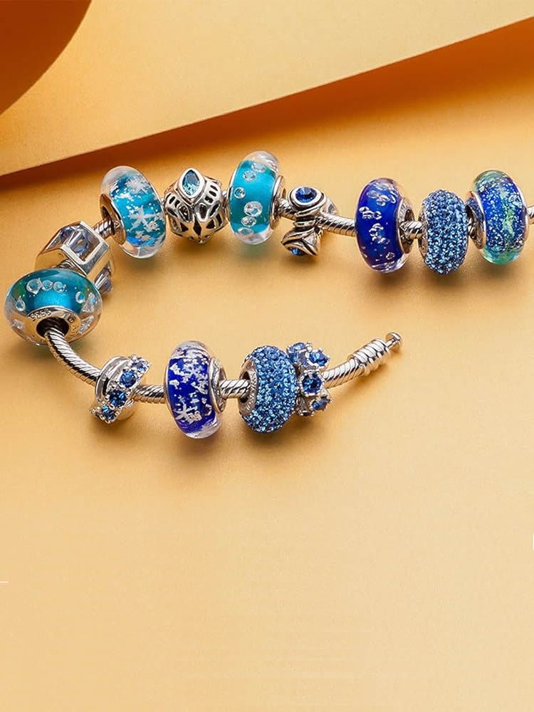 Midnight lagoon murano glass charm paired with snake chain bracelet