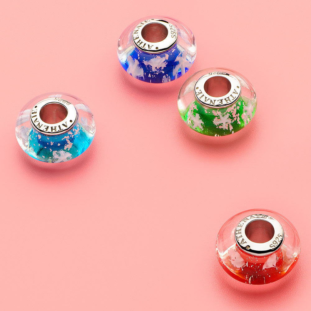 Midnight Snowflake Murano glass charm bead displayed in elegant setting.
