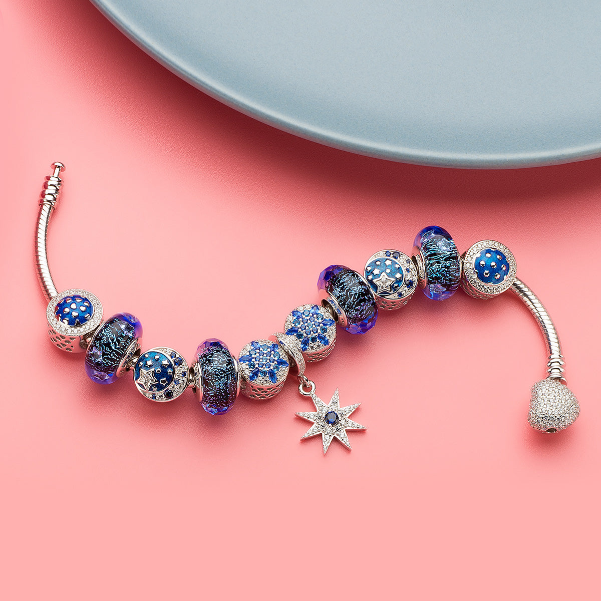 Midnight Star Murano glass charm paired with bracelet styling – starry night Murano bead design