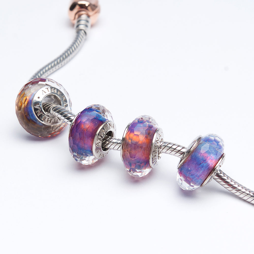 Styled shot of Twilight Prism Mist charm with dreamy bracelet setting