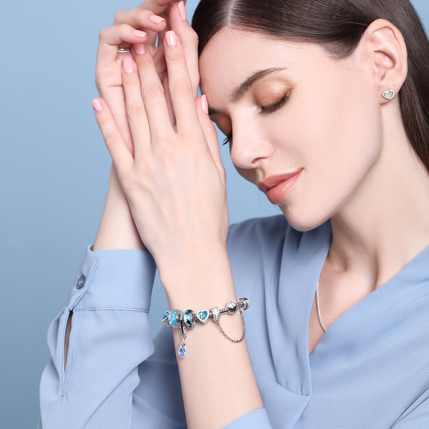 Lifestyle photo of model with 925 silver safety chain charm and bracelet