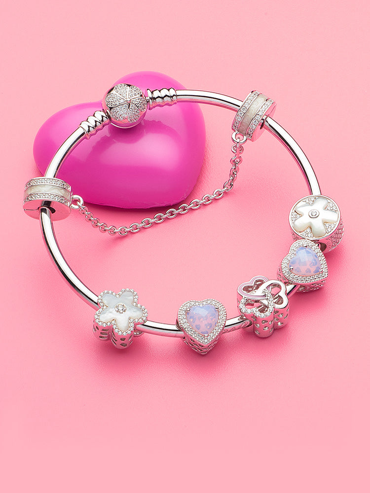 Moonlit flower charm bead combined with sterling silver charm bracelet