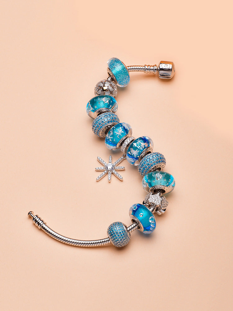 Bracelet styling featuring Moonlit Heart white enamel charm bead