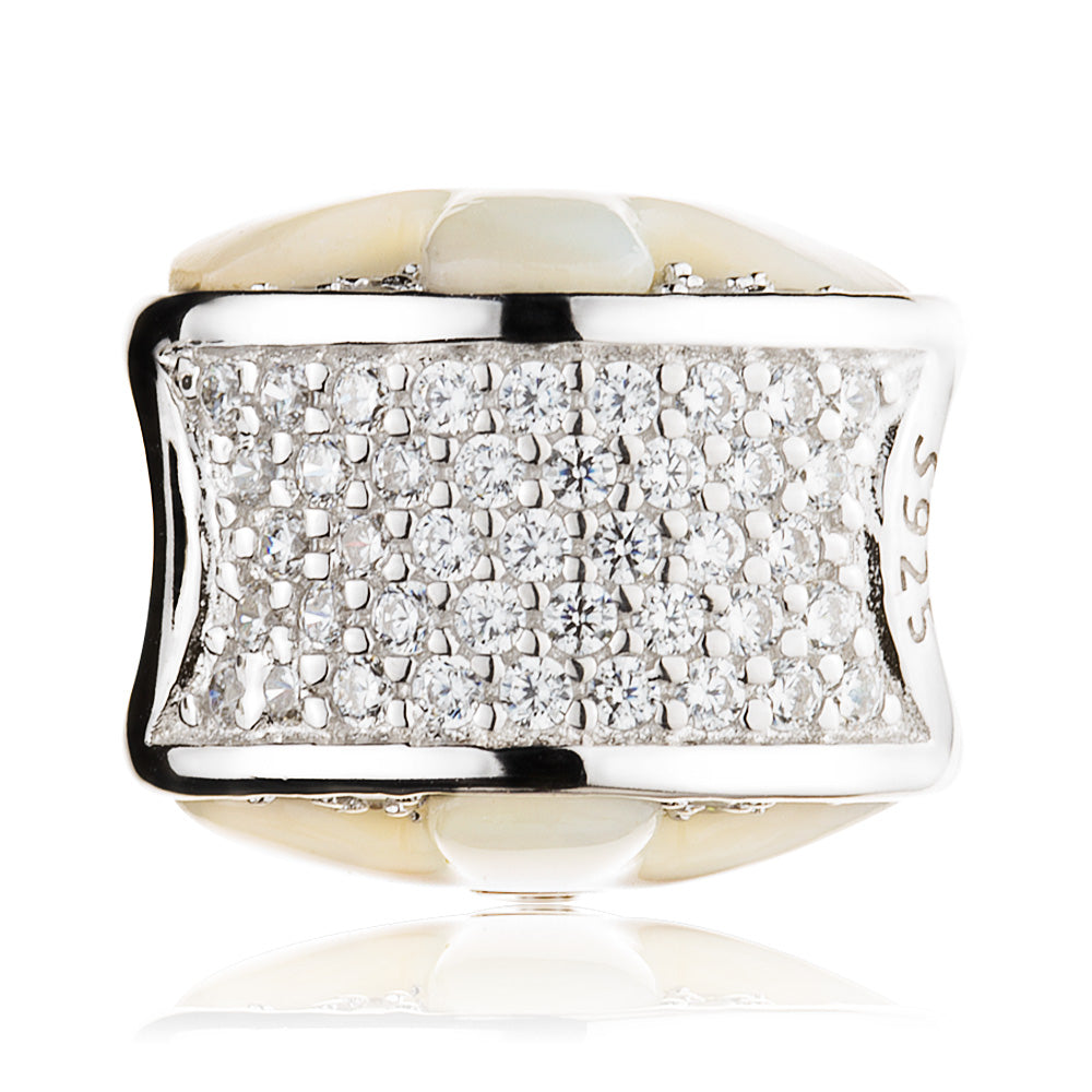 Side view of Moonlit Petal charm bead showing 3D petal texture, CZ sparkle, and silver shell inlay