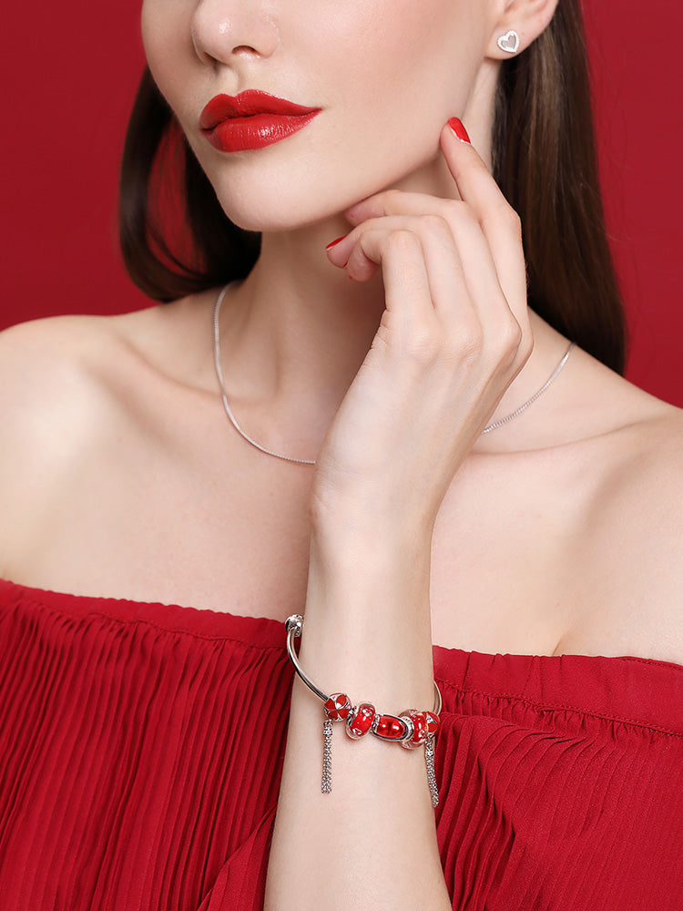 Bracelet styled with crimson heart murano glass charm bead