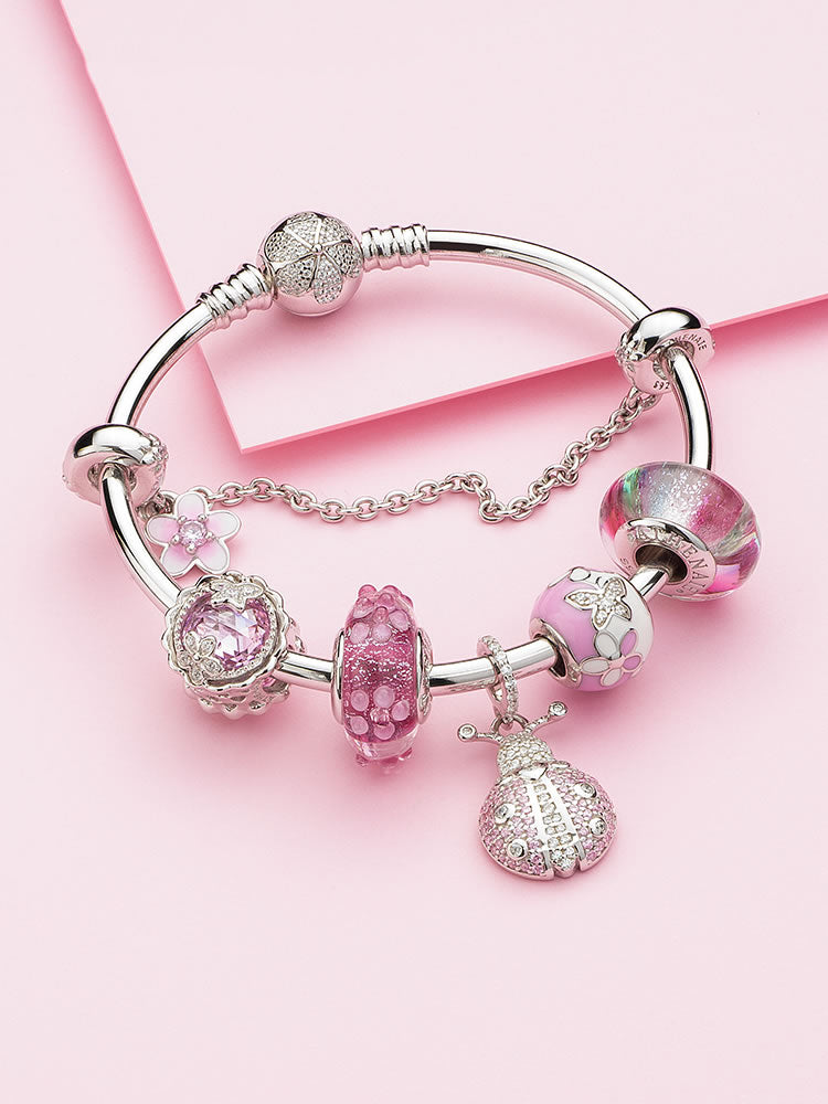 Murano glass charm bead styled on silver charm bracelet