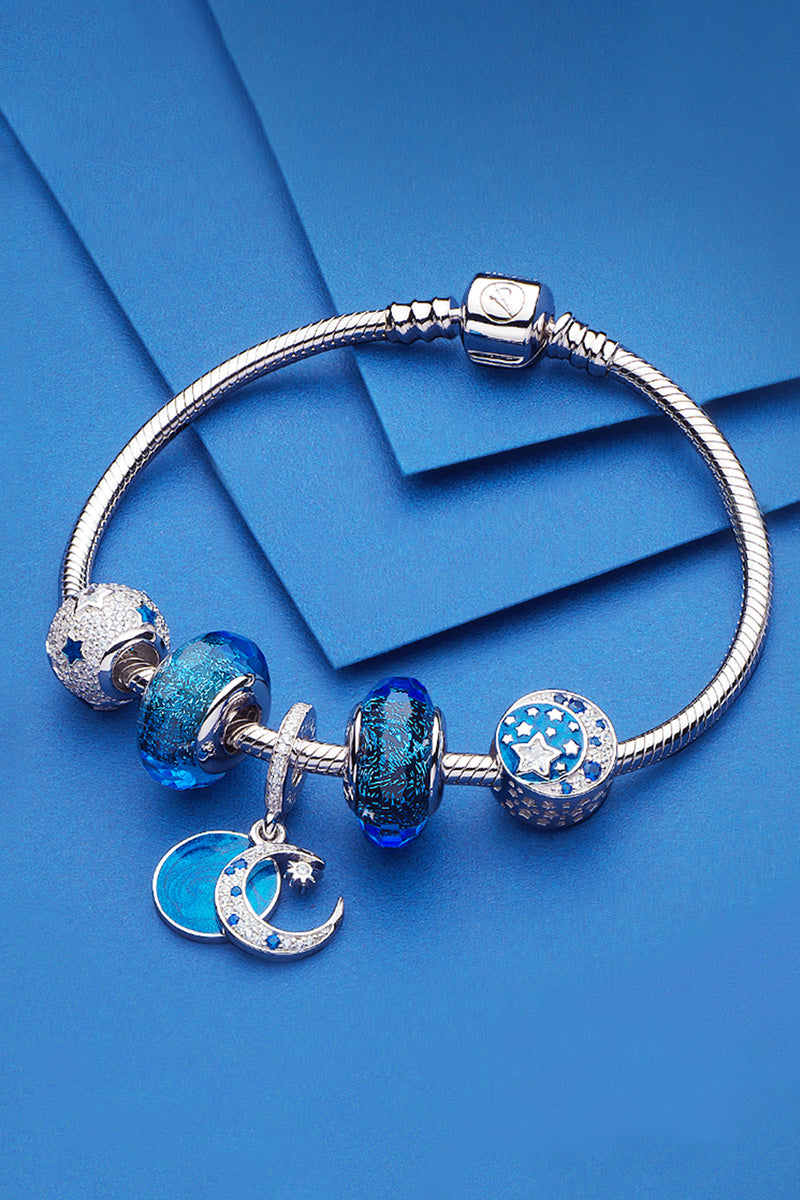 Blue Murano glass charm styled on bracelet