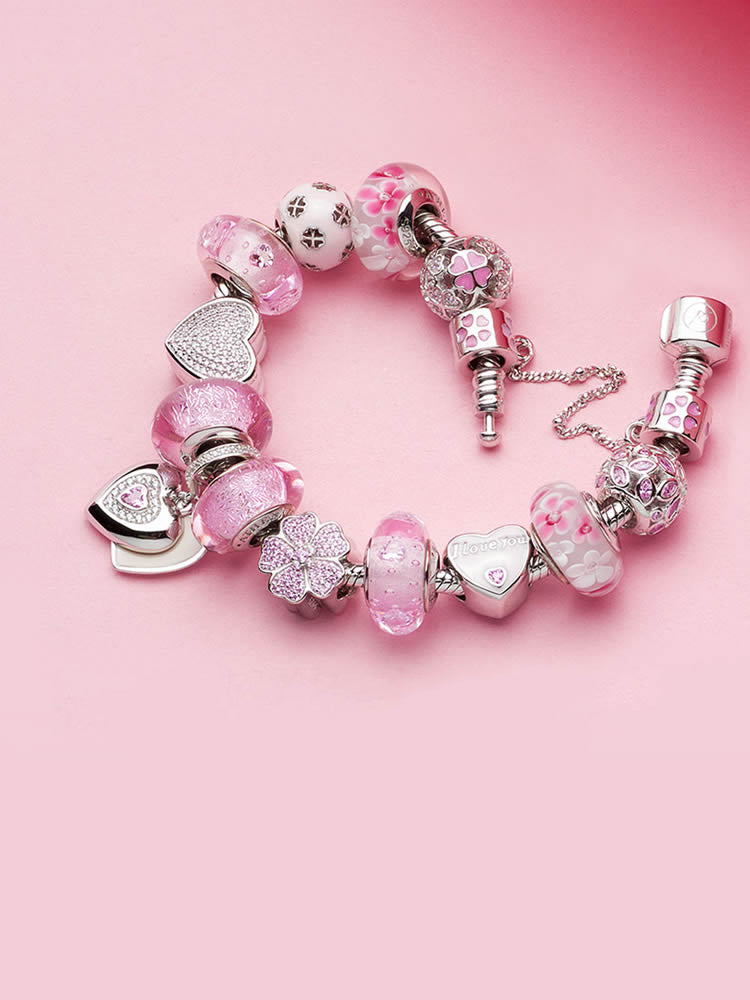 Pink murano glass charm bead styled on sterling silver bracelet