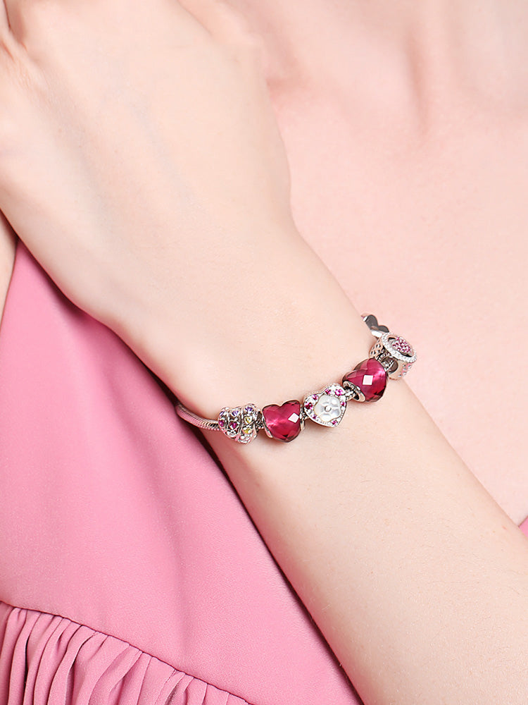 Model wearing crimson Murano glass charm bead bracelet