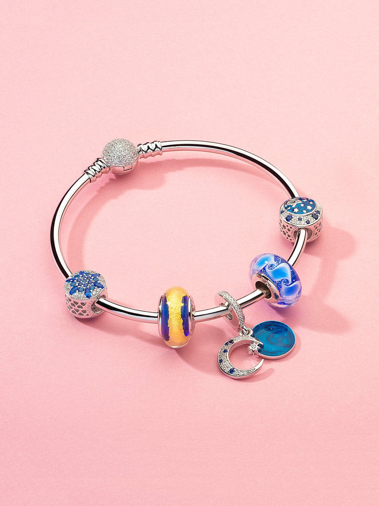 Golden midnight murano glass charm bead styled on charm bracelet