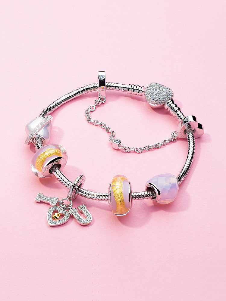 Golden blush murano glass charm bead styled on charm bracelet