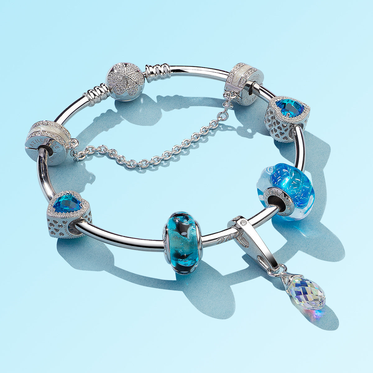 Ocean Breath charm styled on complete silver bracelet with matching beads